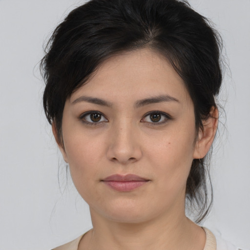 Joyful asian young-adult female with medium  brown hair and brown eyes