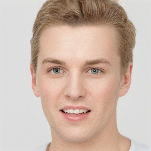 Joyful white young-adult male with short  brown hair and blue eyes