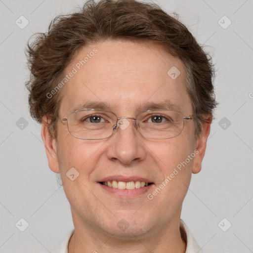 Joyful white adult male with short  brown hair and grey eyes