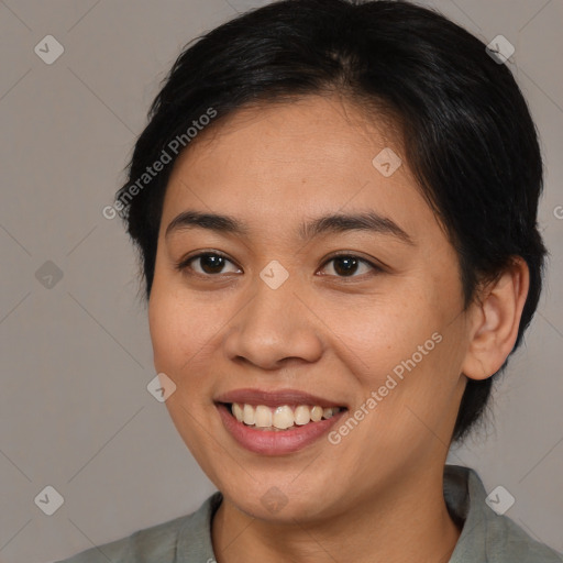 Joyful asian young-adult female with medium  brown hair and brown eyes