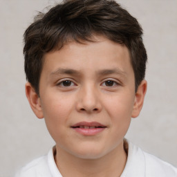 Joyful white child male with short  brown hair and brown eyes