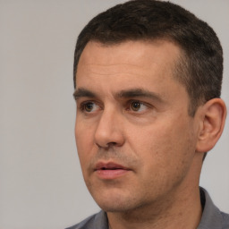 Neutral white adult male with short  black hair and brown eyes