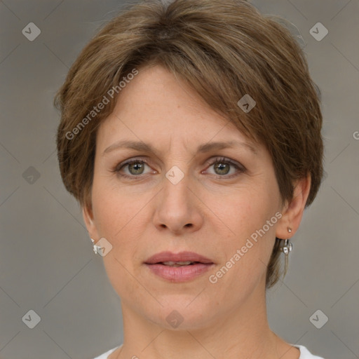 Joyful white adult female with short  brown hair and grey eyes