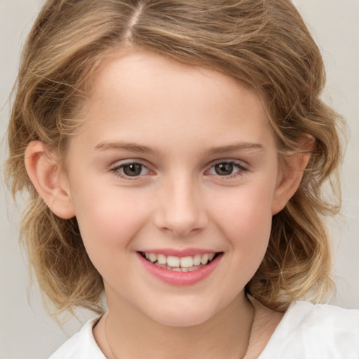 Joyful white child female with medium  brown hair and brown eyes