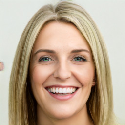 Joyful white young-adult female with long  brown hair and green eyes