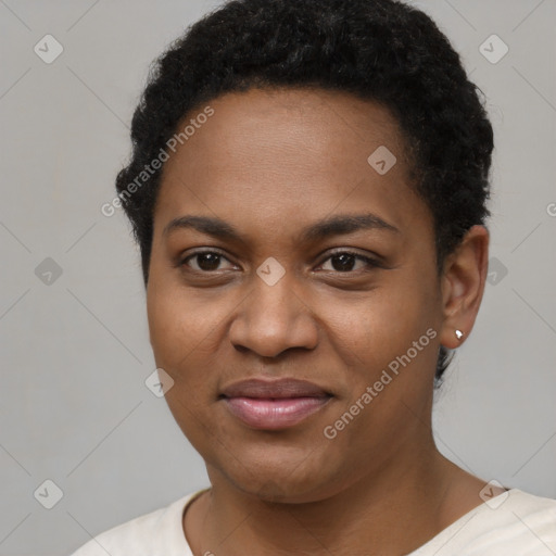 Joyful black young-adult female with short  black hair and brown eyes