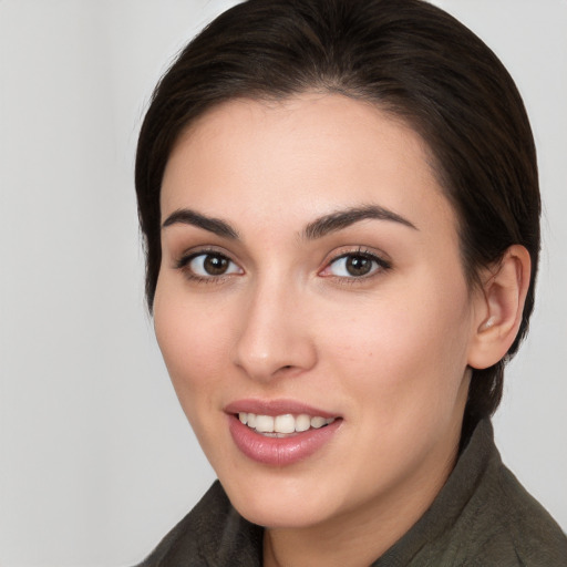 Joyful white young-adult female with medium  brown hair and brown eyes