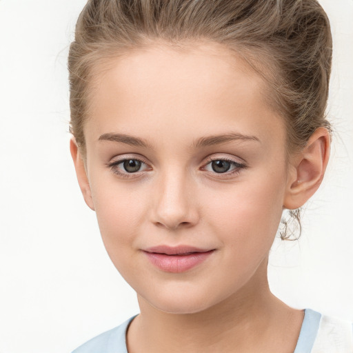 Joyful white child female with medium  brown hair and brown eyes