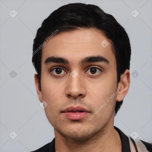 Neutral white young-adult male with short  black hair and brown eyes