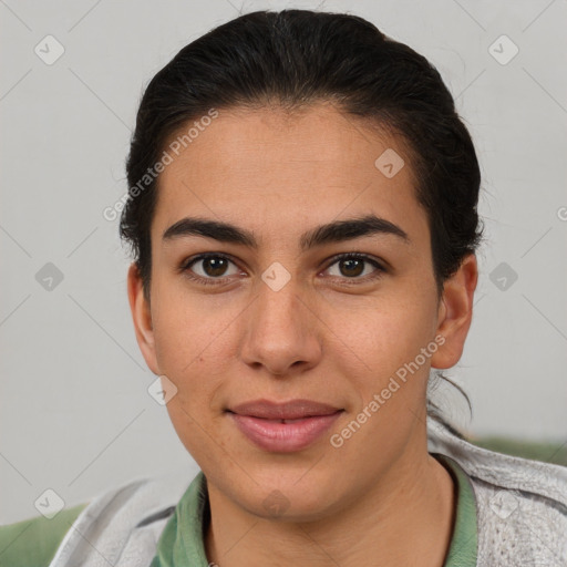 Joyful latino young-adult female with short  brown hair and brown eyes