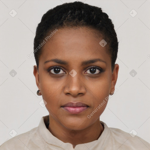 Joyful black young-adult female with short  black hair and brown eyes