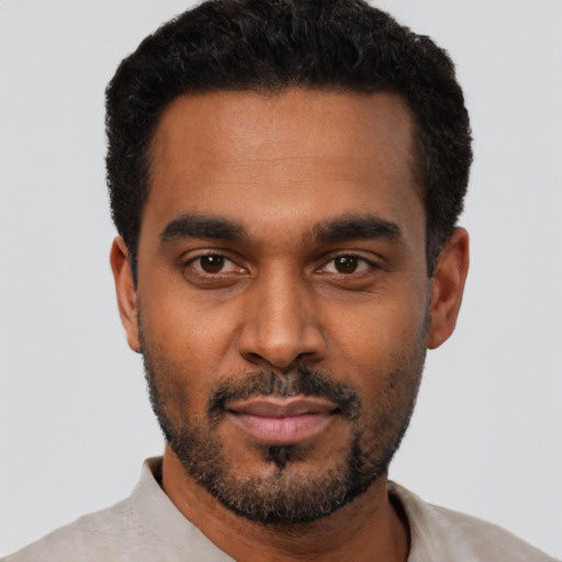 Neutral black young-adult male with short  black hair and brown eyes