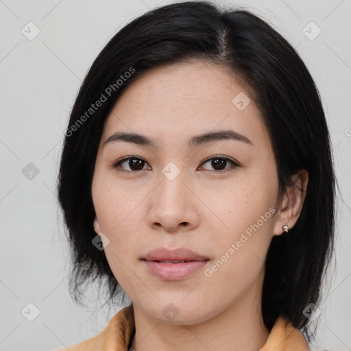 Joyful asian young-adult female with medium  black hair and brown eyes