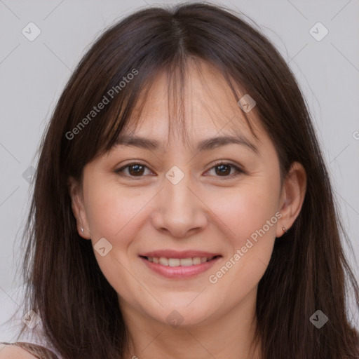 Joyful white young-adult female with long  brown hair and brown eyes