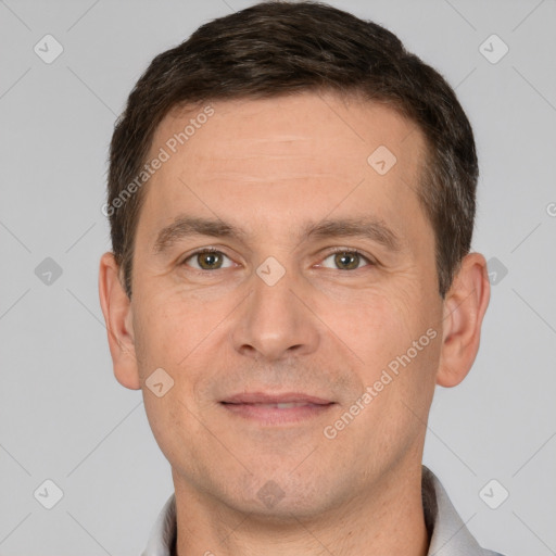 Joyful white adult male with short  brown hair and brown eyes