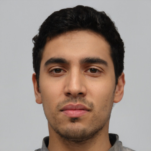 Neutral latino young-adult male with short  black hair and brown eyes