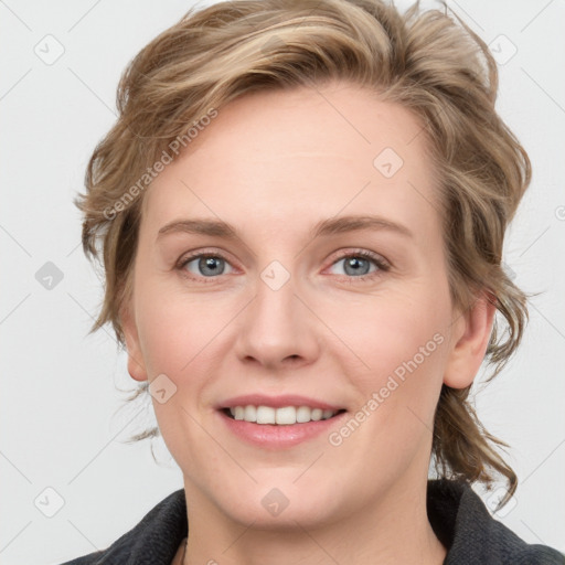 Joyful white young-adult female with medium  brown hair and blue eyes