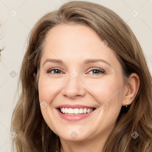 Joyful white adult female with long  brown hair and brown eyes