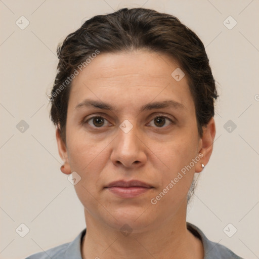 Joyful white adult female with short  brown hair and brown eyes