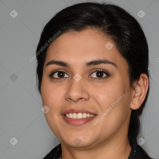 Joyful latino young-adult female with medium  brown hair and brown eyes