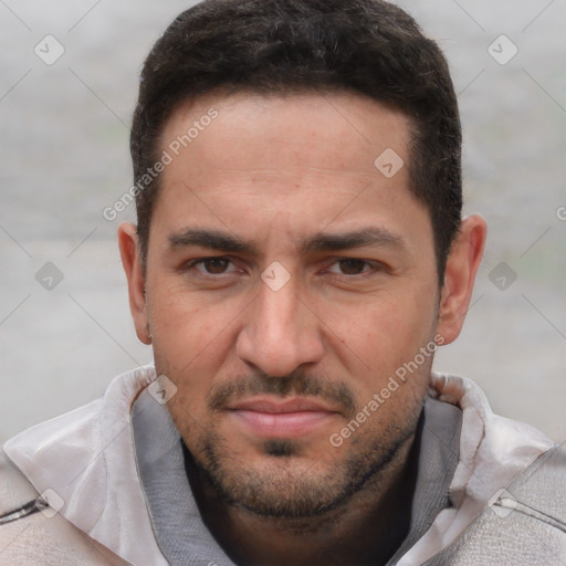 Joyful white young-adult male with short  black hair and brown eyes