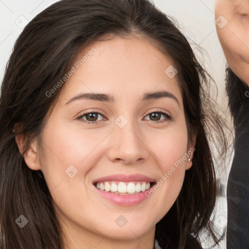 Joyful white young-adult female with long  brown hair and brown eyes