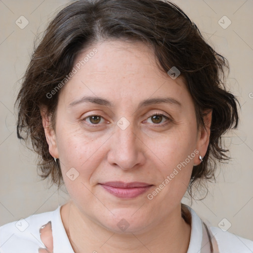 Joyful white adult female with medium  brown hair and brown eyes