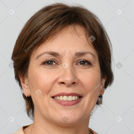 Joyful white adult female with medium  brown hair and brown eyes