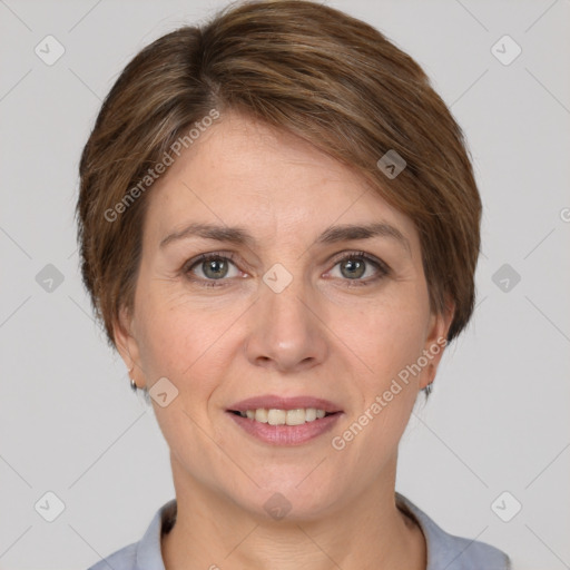 Joyful white adult female with short  brown hair and grey eyes