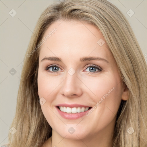 Joyful white young-adult female with long  brown hair and green eyes