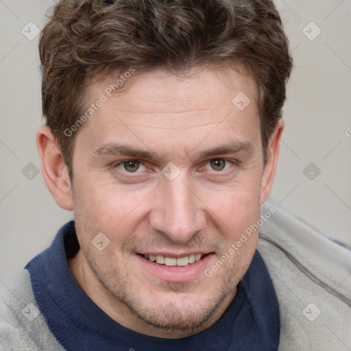 Joyful white adult male with short  brown hair and grey eyes