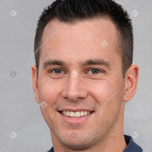 Joyful white adult male with short  brown hair and brown eyes