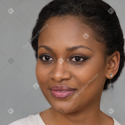 Joyful black young-adult female with medium  brown hair and brown eyes