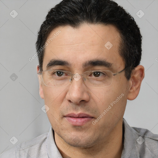 Joyful white adult male with short  black hair and brown eyes