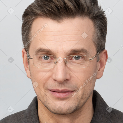 Joyful white adult male with short  brown hair and grey eyes