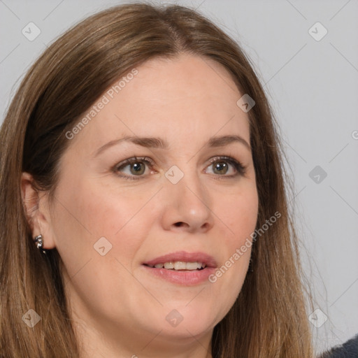 Joyful white adult female with long  brown hair and brown eyes