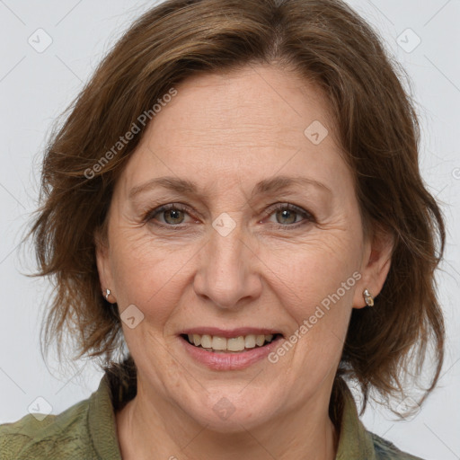 Joyful white adult female with medium  brown hair and grey eyes