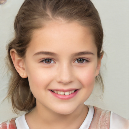 Joyful white child female with medium  brown hair and grey eyes