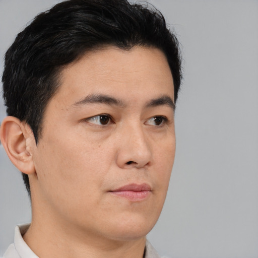 Neutral asian young-adult male with short  brown hair and brown eyes