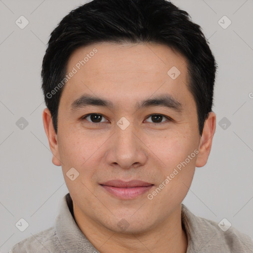 Joyful asian young-adult male with short  black hair and brown eyes