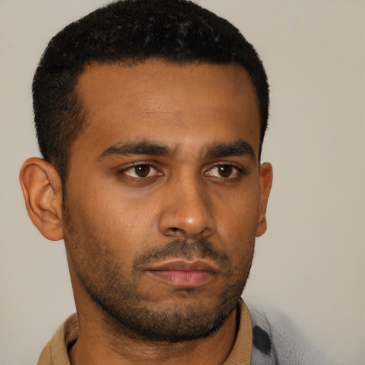 Neutral latino young-adult male with short  black hair and brown eyes