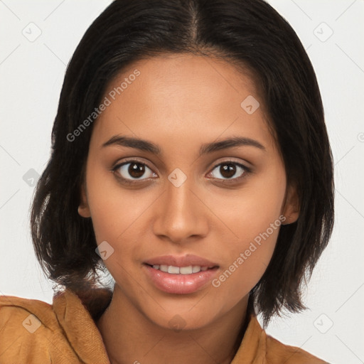 Joyful latino young-adult female with long  brown hair and brown eyes