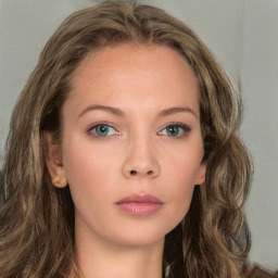 Neutral white young-adult female with long  brown hair and green eyes