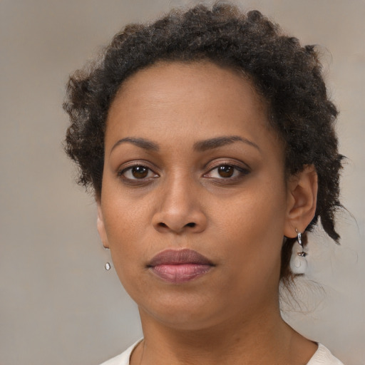Neutral black young-adult female with short  brown hair and brown eyes