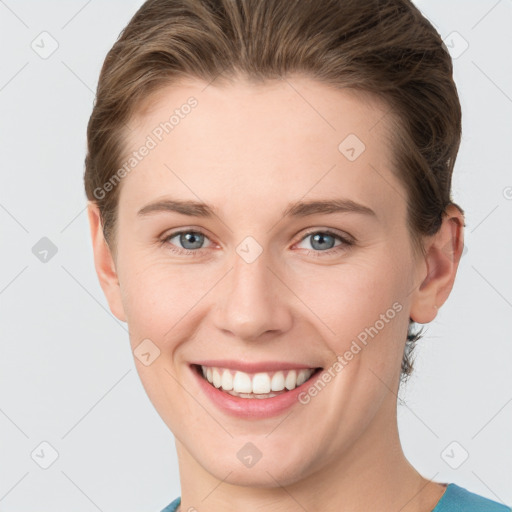 Joyful white young-adult female with short  brown hair and grey eyes