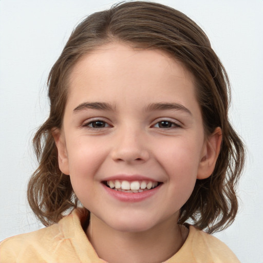 Joyful white child female with medium  brown hair and brown eyes