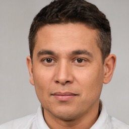 Joyful white adult male with short  brown hair and brown eyes