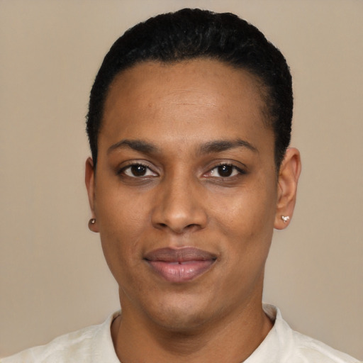 Joyful black young-adult female with short  black hair and brown eyes
