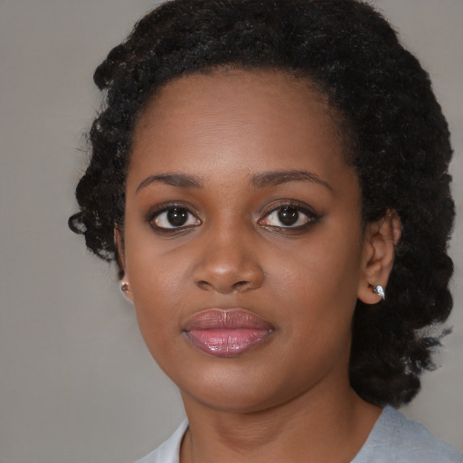 Neutral black young-adult female with medium  black hair and brown eyes