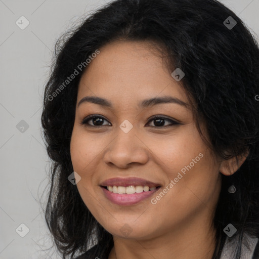 Joyful latino young-adult female with long  brown hair and brown eyes